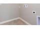 Laundry room with tile floor and hookups for a washer and dryer at 6410 Avacado Dr, Indianapolis, IN 46217