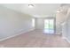 Spacious living room features carpet, stairs, window, and sliding doors at 6410 Avacado Dr, Indianapolis, IN 46217
