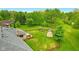Aerial view of a backyard with wooden deck, playset, shed and wood privacy fence at 6462 Wings Ct, Brownsburg, IN 46112