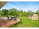 Outdoor living with deck, backyard shed, playset, and privacy fence at 6462 Wings Ct, Brownsburg, IN 46112