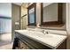 Bathroom featuring a double sink vanity with a modern, dark-wood cabinet at 6462 Wings Ct, Brownsburg, IN 46112
