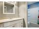 A bright bathroom features a spacious vanity, mirror and shower/tub combination at 6462 Wings Ct, Brownsburg, IN 46112