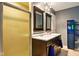Bathroom with double sink vanity, dark wood cabinets and a glass shower door at 6462 Wings Ct, Brownsburg, IN 46112
