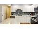 Charming kitchen with white cabinets, granite countertops, and stainless steel appliances at 6462 Wings Ct, Brownsburg, IN 46112