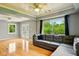 Bright and airy living room with hardwood floors, coffered ceiling, and backyard views at 6462 Wings Ct, Brownsburg, IN 46112