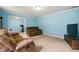 Comfortable living room featuring plush sofas, neutral carpet and soft blue walls at 6462 Wings Ct, Brownsburg, IN 46112