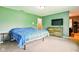 Spacious bedroom featuring a TV, natural light, and neutral carpet at 6462 Wings Ct, Brownsburg, IN 46112