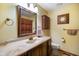 Bathroom featuring a vanity with a marble countertop, bronze fixtures, and an ornate wall clock at 6794 E Ann St, Camby, IN 46113