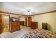 Cozy bedroom featuring floral wallpaper, ceiling fan, and ample closet space at 6794 E Ann St, Camby, IN 46113