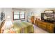 Comfortable bedroom with a vintage dresser and decoratively framed television at 6794 E Ann St, Camby, IN 46113