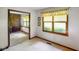Bright bedroom with large window offering ample natural light and mirrored closet sliding doors at 6794 E Ann St, Camby, IN 46113