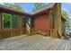 Spacious wooden deck with stairs, plants, and railings, perfect for outdoor relaxation and entertaining at 6794 E Ann St, Camby, IN 46113