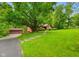 Beautiful single-story home with a detached garage on a sprawling lot with mature shade trees at 6794 E Ann St, Camby, IN 46113