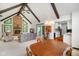 Inviting living room features a stone fireplace, exposed beams, and lots of natural light at 6794 E Ann St, Camby, IN 46113