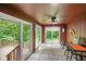 Cozy sunroom with a ceiling fan and multiple windows offering great views of the yard and trees at 6794 E Ann St, Camby, IN 46113