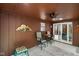 Cozy sunroom with a decorative ceiling fan and furniture, featuring a sliding glass door to the outside at 6794 E Ann St, Camby, IN 46113
