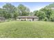 Backyard with green grass and a fenced in area at 7503 Grandview Dr, Indianapolis, IN 46260