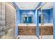 Bathroom with a double sink vanity and tiled floors at 7503 Grandview Dr, Indianapolis, IN 46260