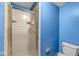 Bathroom with glass shower stall and white toilet at 7503 Grandview Dr, Indianapolis, IN 46260