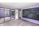 Bedroom with purple walls, carpet floors, a mirror door closet and a chalkboard at 7503 Grandview Dr, Indianapolis, IN 46260