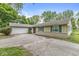 Attractive ranch-style home with an attached garage at 7503 Grandview Dr, Indianapolis, IN 46260