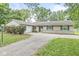 Charming ranch home featuring an attached garage and driveway at 7503 Grandview Dr, Indianapolis, IN 46260