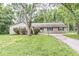 Ranch style home with mature trees and landscaping at 7503 Grandview Dr, Indianapolis, IN 46260