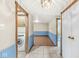 Hallway with access to laundry, bathroom, and living area at 7503 Grandview Dr, Indianapolis, IN 46260
