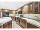 A kitchen with stainless steel appliances, wood cabinets and countertops, and wood laminate floors at 7503 Grandview Dr, Indianapolis, IN 46260