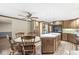 The kitchen features wood cabinets, stainless steel appliances, and center island with a dining area at 7503 Grandview Dr, Indianapolis, IN 46260
