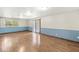 Open living area with laminate floors and sliding glass door at 7503 Grandview Dr, Indianapolis, IN 46260