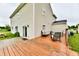 Spacious wooden deck with outdoor seating area and a lush green backyard perfect for entertaining and relaxing at 7604 Cloudy Ct, Camby, IN 46113