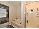 Bathroom showcasing a shower and soaking tub, with a walk-in closet located in the background at 7604 Cloudy Ct, Camby, IN 46113