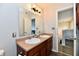 Double sink bathroom vanity and mirror; functional, well-lit space at 7604 Cloudy Ct, Camby, IN 46113
