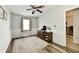 Bright bedroom boasts wood-look floors, natural light, and classic wainscoting for added charm at 7604 Cloudy Ct, Camby, IN 46113
