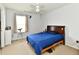Cozy bedroom featuring a comfortable bed, carpet flooring, and a bright window at 7604 Cloudy Ct, Camby, IN 46113