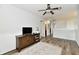 Bright bedroom boasts wood-look floors, natural light, and classic wainscoting for added charm at 7604 Cloudy Ct, Camby, IN 46113