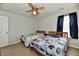 Bright bedroom with two twin beds, fan and window at 7604 Cloudy Ct, Camby, IN 46113