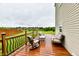 Well-maintained wooden deck with outdoor furniture, perfect for relaxing and enjoying the green backyard at 7604 Cloudy Ct, Camby, IN 46113