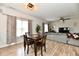 Inviting dining area with wood table, laminate floors and stylish light fixture at 7604 Cloudy Ct, Camby, IN 46113