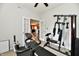 Well-equipped exercise room with fitness bike and weight training machine at 7604 Cloudy Ct, Camby, IN 46113