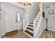 Inviting foyer with staircase and neutral colors, leading to upper level at 7604 Cloudy Ct, Camby, IN 46113