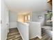 Bright hallway with hardwood floors, neutral paint, and access to living area and bedrooms at 7604 Cloudy Ct, Camby, IN 46113