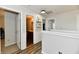 Hallway includes half wall separating rooms and access to updated bathroom with nice wooden cabinets at 7604 Cloudy Ct, Camby, IN 46113