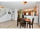Open-concept living area with staircase, neutral walls, and laminate flooring at 7604 Cloudy Ct, Camby, IN 46113