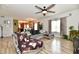 Large living room with wood floors and an open layout to the kitchen at 7604 Cloudy Ct, Camby, IN 46113