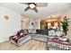Spacious living room with an open view to the kitchen and stairway at 7604 Cloudy Ct, Camby, IN 46113