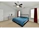 Bright and spacious main bedroom with vaulted ceiling, two windows, and plush carpet at 7604 Cloudy Ct, Camby, IN 46113