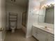 Clean bathroom featuring marble countertops, modern fixtures, and a shower, offering comfort and functionality at 7645 Briarstone Ln, Indianapolis, IN 46227