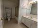 Clean bathroom featuring marble countertops, modern fixtures, and a shower, offering comfort and functionality at 7645 Briarstone Ln, Indianapolis, IN 46227